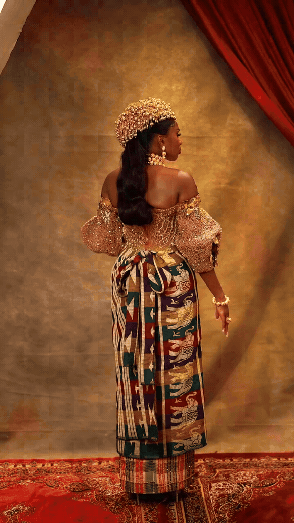 Anita in a custom TUBO Ikwerre Rivers State bridal outfit, featuring layered George and Ikaki fabrics in multicolour with gold-embellished blouse.