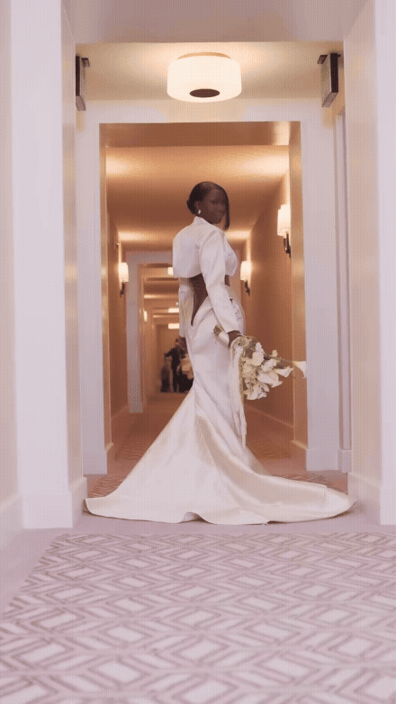 Shalom Blac in a custom TUBỌ bridal gown during her elopement, radiating grace and strength in an intimate ceremony captured by KD Photo Production.