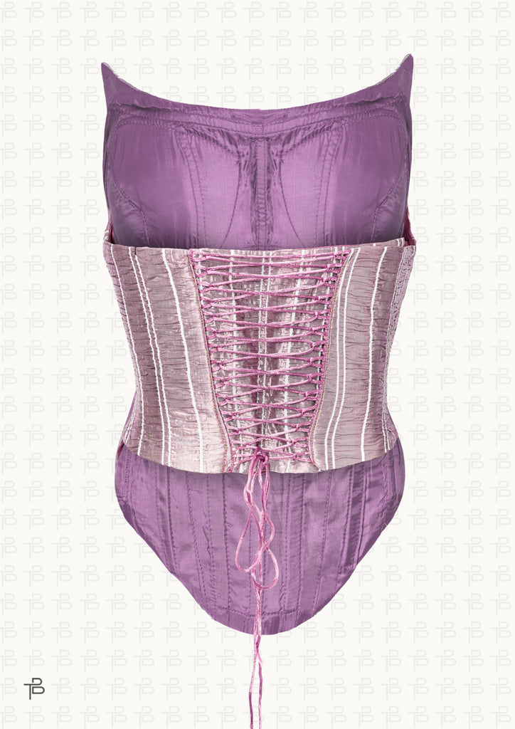 Ari Corset in pink, a sculpted striped top with vertical lines, fitted bodice, and structured silhouette.